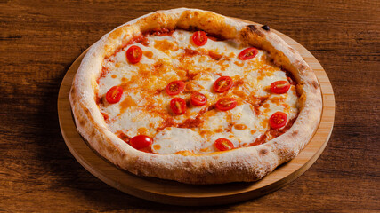 Delicious pizza margarita isolated on wooden background