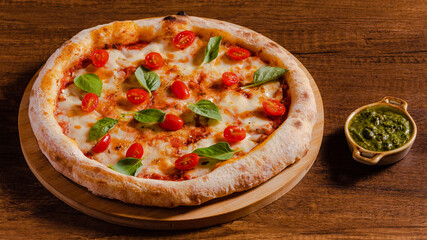 Delicious pizza margarita isolated on wooden background