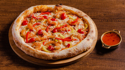 Delicious prawns pizza isolated on wooden background