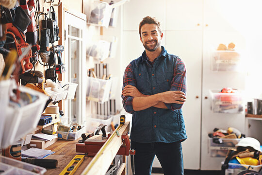 Tools, smile and portrait of man in workshop for furniture, manufacturing and small business production. Male person, happy and handyman with equipment for renovation, maintenance or remodeling