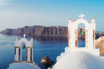 white belfries Santorini island, Greece - obrazy, fototapety, plakaty