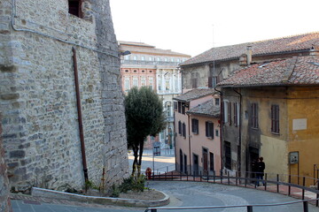 Quiet afternoon on an empty street in Perugia, Italy, featuring a scenic roadway