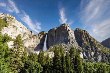 Foto auf Glas Yosemite National Park...Granite rocks and a pine forest frame Upper Yosemite Fall in a thunderous drop. Taken from Yosemite Valley in June 2023 when record snow resulted in peak water flow. © Donna Bollenbach