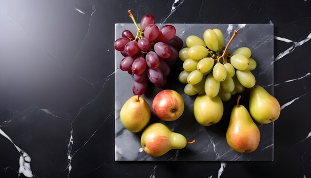 Fresh grapes and pears on marble board