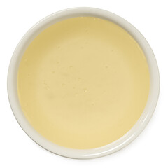 Rice syrup in a white ceramic bowl isolated on white from above.