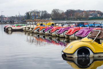 Multicolored catamarans on the lake