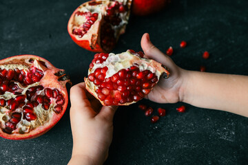 Pomegranate on Phantom Blue background. Top view, close up, background