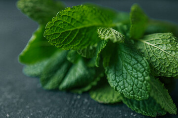 Fresh organic mint leaves ready for cooking on the kitchen table