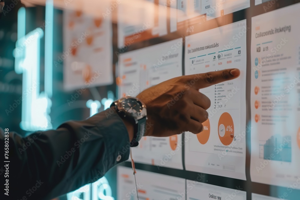 Poster a professional examining data charts on a digital screen with focus and precision.