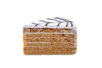 Honey cake with icing and chocolate on a white isolated background