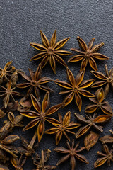 star anise close-up, on a black background, copy space