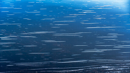 White lines on the water.White patterns on blue background.