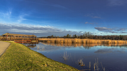 A landscape of wetlands on the Suprasl River in Podlasie on a march morning at sunrise.