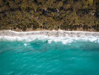 Drone Birdseye view of Adventure Bay, Tasmania, Australia. Blue water with shadows during sunset....