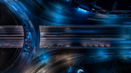 Expressway top view, Road traffic an important infrastructure, Drone aerial view fly in circle, traffic transportation, Public transport or commuter city life concept of economic and energ, transport. - obrazy, fototapety, plakaty