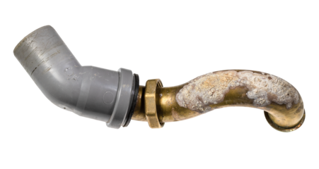 brass bathtub sewer pipe covered with corrosion with plastic elbow isolated on white background