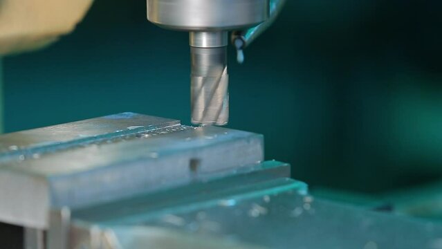 machining center high precision vertical CNC turning machine drilling on metal component in shaping forming process vertical machining centre control automation milling workpiece rotating