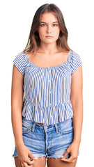 Obraz premium Beautiful caucasian woman wearing casual clothes with serious expression on face. simple and natural looking at the camera.