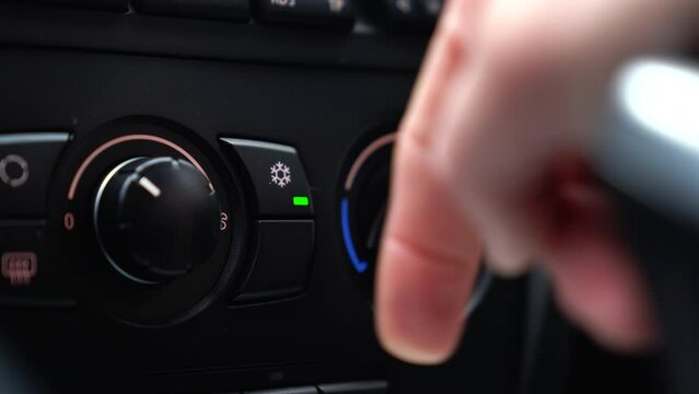 Close-up 4k - Turning on the air conditioner in the car