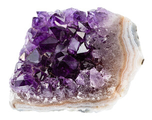 close up of sample of natural stone from geological collection - geode of amethyst mineral crystals...