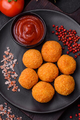 Delicious  balls of mozzarella and parmesan cheese with salt and spices