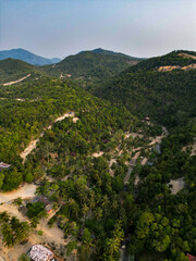 Aerial drone view small Koh Ma island, Ko Phangan Thailand. Exotic coast panoramic landscape, Mae Haad beach, summer day. Sandy path between corals. Vivid seascape, mountain coconut palms from above.
