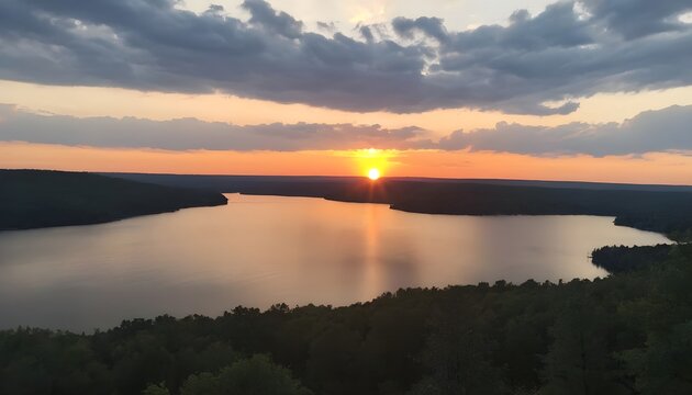 sunset over lake from jumping off rock overlook