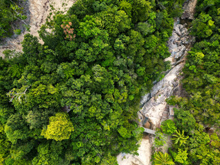 Aerial drone view small Koh Ma island, Ko Phangan Thailand. Exotic coast panoramic landscape, Mae Haad beach, summer day. Sandy path between corals. Vivid seascape, mountain coconut palms from above.