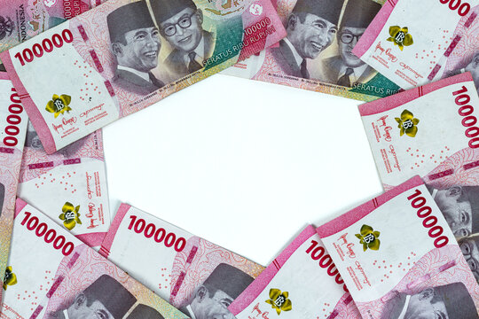 Indonesian rupiah currency. Background of IDR 100,000 rupiah banknotes. financial condition. Top view point. copy space
