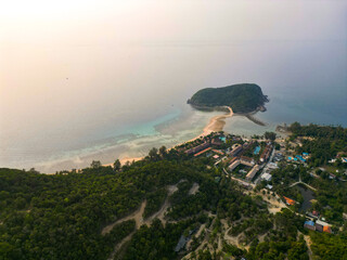 Aerial drone view small Koh Ma island, Ko Phangan Thailand. Exotic coast panoramic landscape, Mae Haad beach, summer day. Sandy path between corals. Vivid seascape, mountain coconut palms from above.