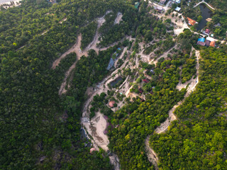 Aerial drone view small Koh Ma island, Ko Phangan Thailand. Exotic coast panoramic landscape, Mae Haad beach, summer day. Sandy path between corals. Vivid seascape, mountain coconut palms from above.