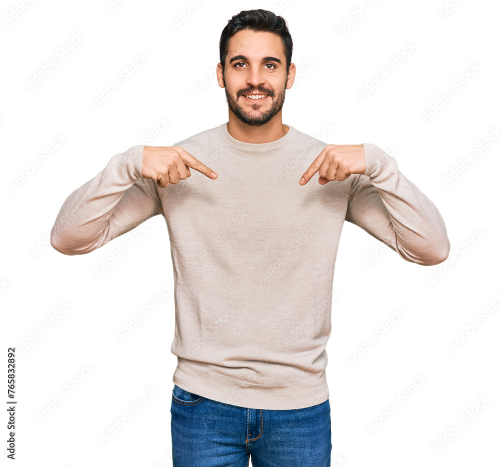 Wall mural young hispanic man wearing casual clothes looking confident with smile on face, pointing oneself wit