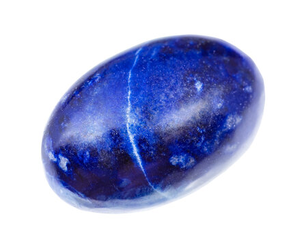 close up of sample of natural stone from geological collection - tumled dark blue lapis lazuli mineral isolated on white background from Afghanistan
