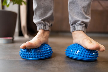 male heel massage with massage tool for myofascial therapy closeup. device for foot massage.
