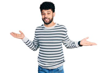 Young arab man with beard wearing casual striped sweater clueless and confused expression with arms and hands raised. doubt concept.