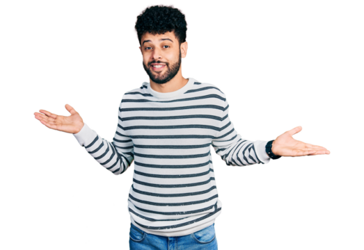 Young arab man with beard wearing casual striped sweater clueless and confused expression with arms and hands raised. doubt concept.