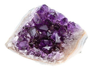 close up of sample of natural stone from geological collection - rough geode of amethyst crystals...