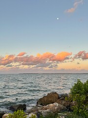 Beautiful sunset with full moon on the coast of Belize City