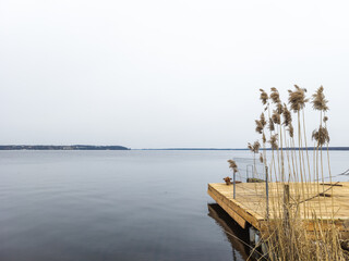 A new wooden platform on the shore of the lake.
