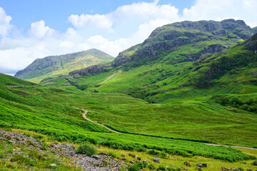 Beautiful lush green Scottish Highlands of Glen Coe, Scotland, UK. - 765848475