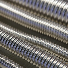 A lot shiny Stainless steel sylphon corrugated pipes technical metal background texture