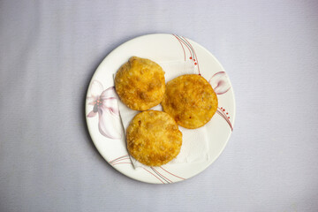 Deep Fried Aloo Puri filling with potatos served in plate isolated on background top view of bangladeshi, indian and pakistani traditional spicy food