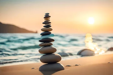 Poster Im Rahmen Stack of balancing pebble stones on sand and water edge © Ateeq