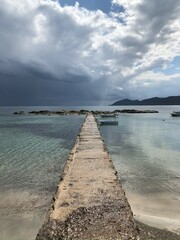 Fototapeta na wymiar Old Ibiza pier on stormy day