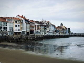 Traditional houses on the ocean shore with low tide