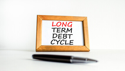 Long term debt cycle symbol. Concept words Long term debt cycle on beautiful white wooden frame. Black pen. Beautiful white background. Business Long term debt cycle concept. Copy space.