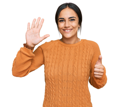 Young brunette woman wearing casual winter sweater showing and pointing up with fingers number six while smiling confident and happy.