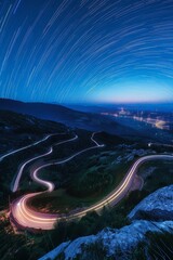 Car lights streak along a winding road at night in a long exposure shot, creating mesmerizing patterns