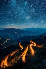 A winding road cuts through the landscape under a starry night sky, creating a mesmerizing visual as the stars twinkle above