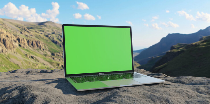 A mockup of an laptop with a green screen, natural landscape background